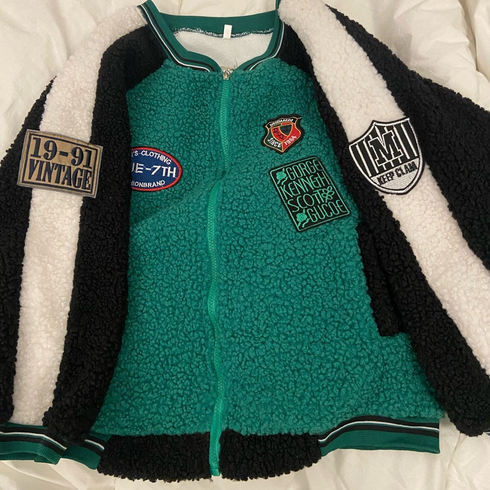 Green varsity jacket with cute symbols/tag on top
